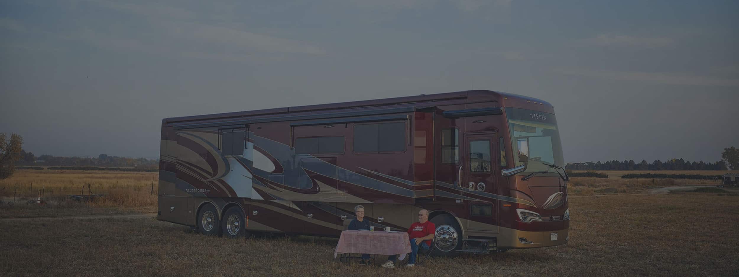 Thor Industries Acquires by Airxcel Europe (2 people eating in front of a bus)